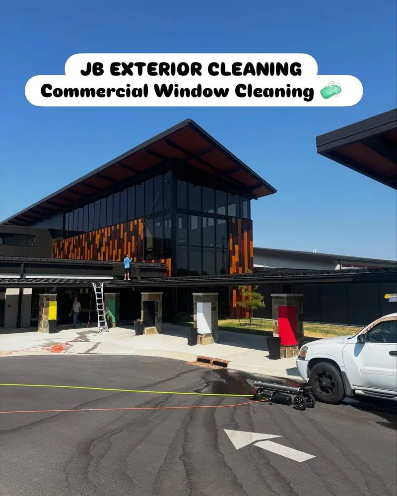 JB crew cleaning windows on a large commercial building