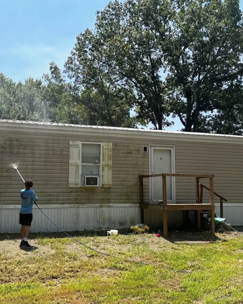 JB crew soft washing a home